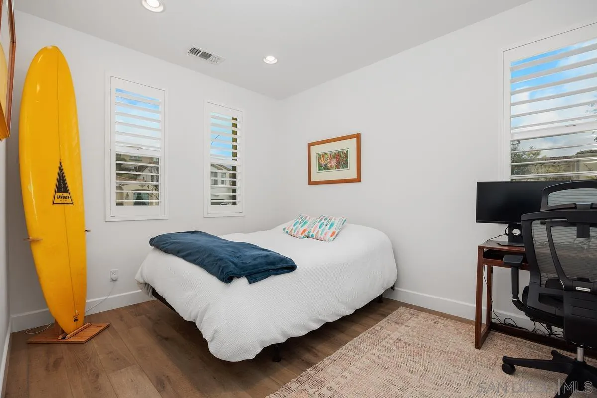 3741 Bergen Peak Place Carlsbad, CA 92010 - Photo 20 of 39 a bedroom with a bed and a chair