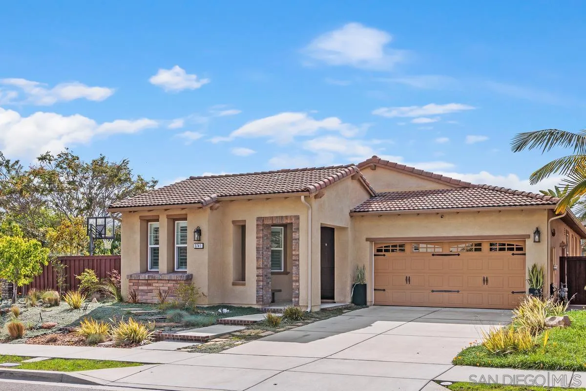 3741 Bergen Peak Place Carlsbad, CA 92010 - Photo 2 of 39 a front view of a house with garden