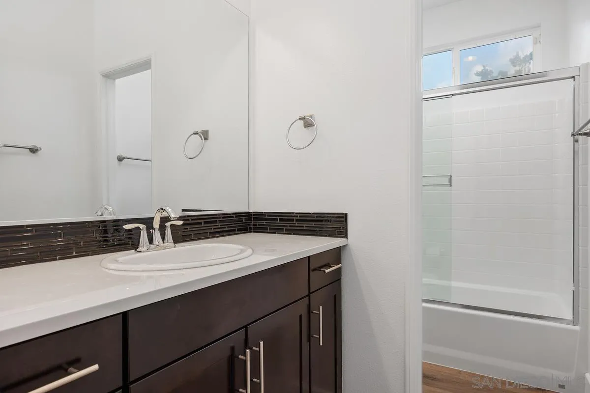 3741 Bergen Peak Place Carlsbad, CA 92010 - Photo 21 of 39 a bathroom with a sink and a mirror