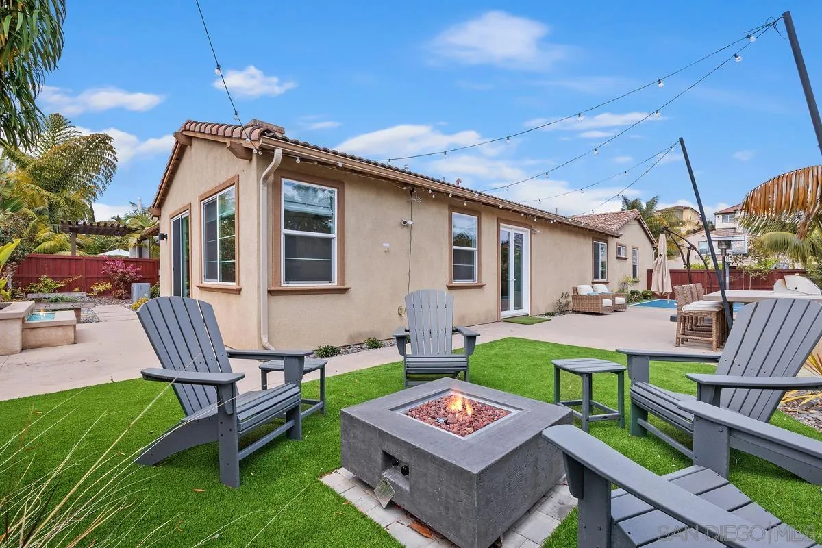 3741 Bergen Peak Place Carlsbad, CA 92010 - Photo 23 of 39 a view of a chairs and table in backyard of the house