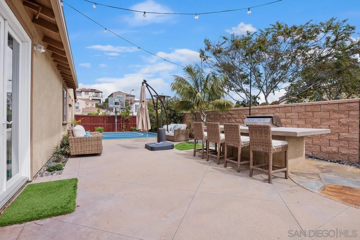 3741 Bergen Peak Place Carlsbad, CA 92010 - Photo 24 of 39 a view of a patio with a table and chairs and potted plants
