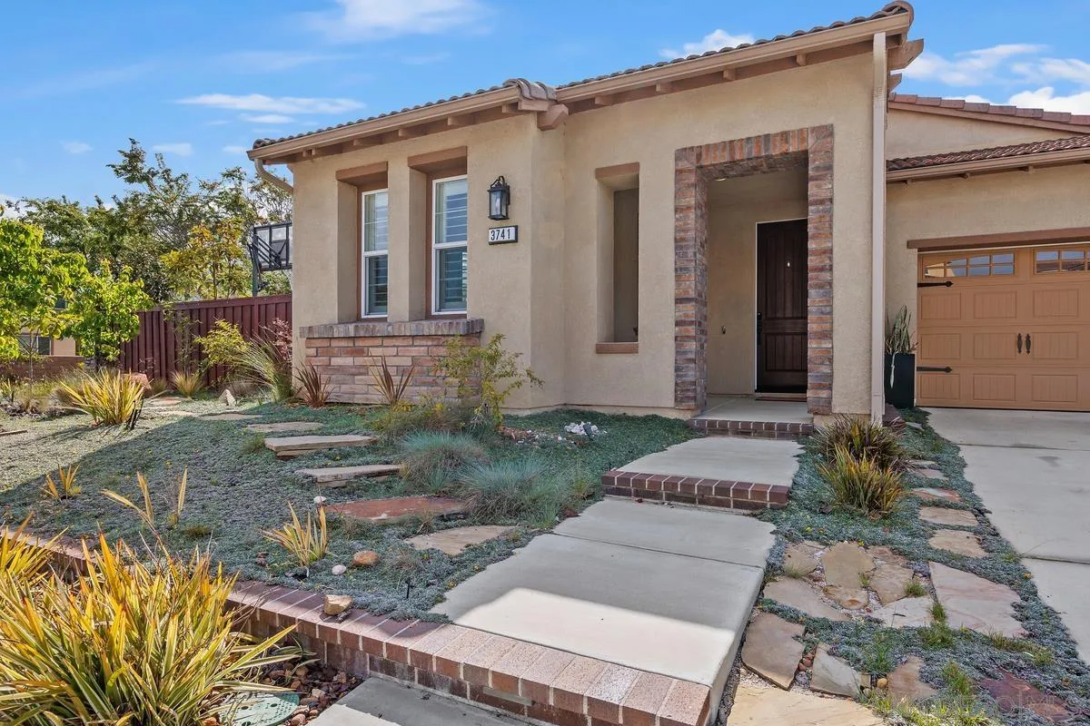 3741 Bergen Peak Place Carlsbad, CA 92010 - Photo 3 of 39 front view of a house with a yard