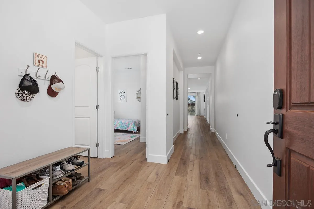 3741 Bergen Peak Place Carlsbad, CA 92010 - Photo 4 of 39 a view of hallway with wooden floor