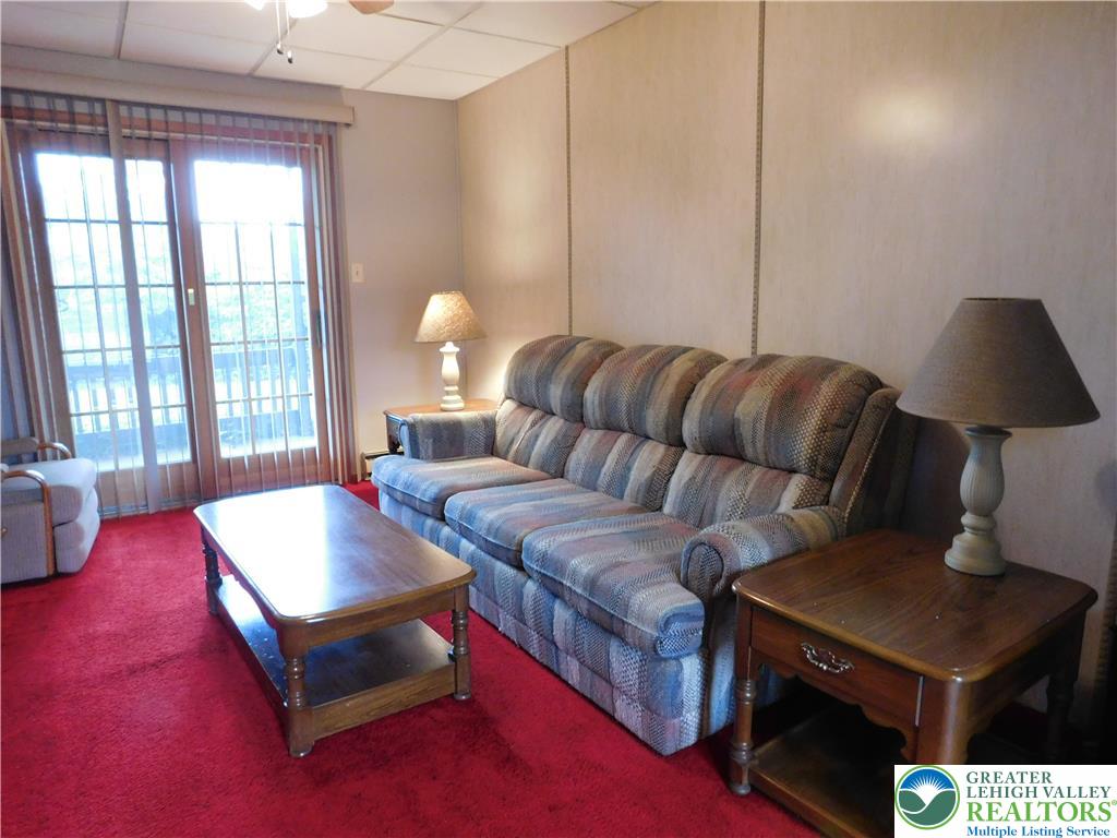 21 Will Barnesville, PA 18214 - Photo 5 of 23 A vibrant red carpet enhances this comfortable living space with sliding glass doors to outdoor views.