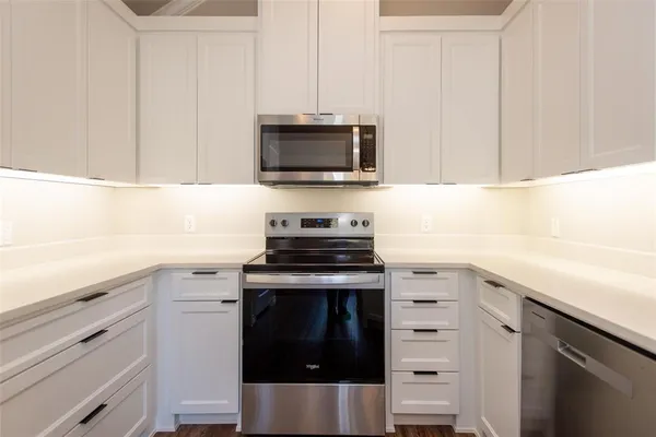 a kitchen with a stove and a sink