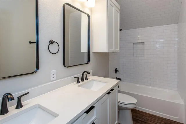 a bedroom with a bed and glass window