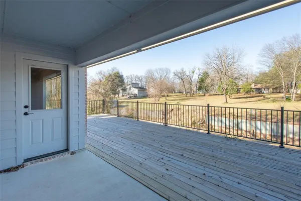 a view of house with backyard and wooden floor