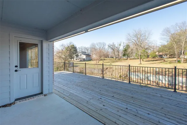 a view of house with backyard and wooden floor