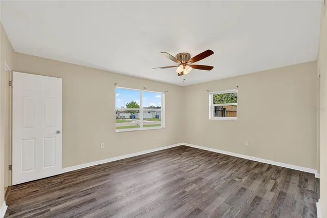 a bathroom with a sink a toilet a mirror and shower