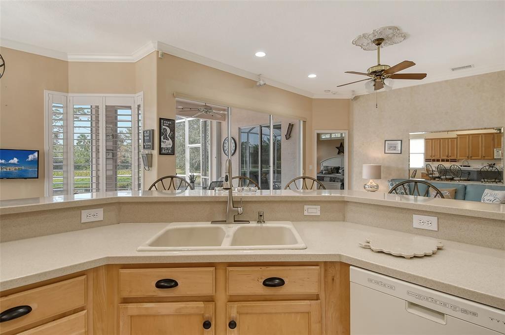 6504 Copper Ridge Trail Bradenton, FL 34201 - Photo 17 of 55 View from kitchen sink to family room and lanai