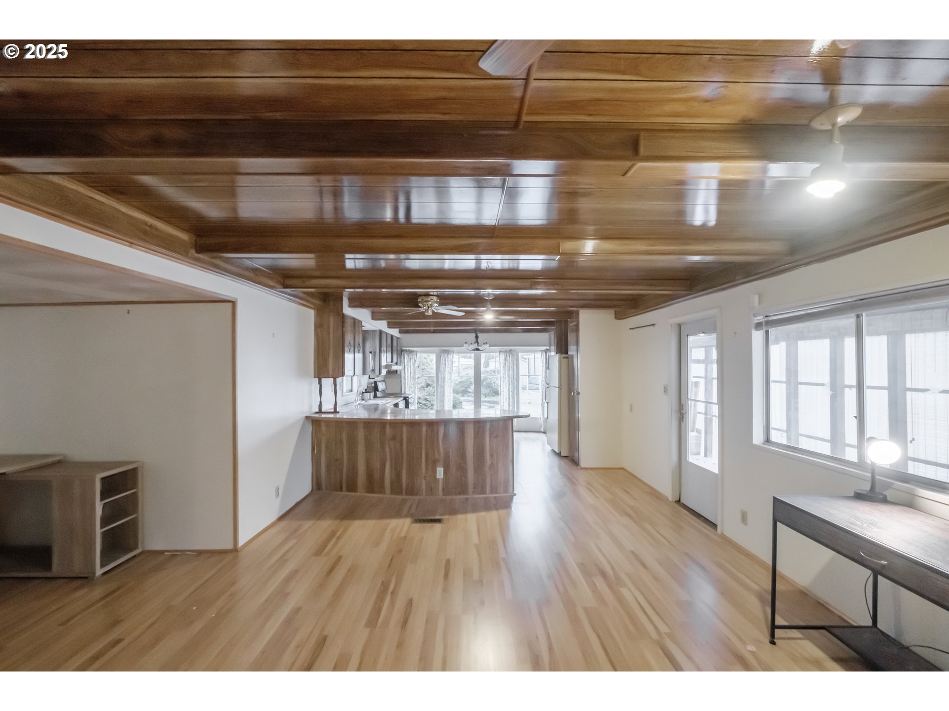 3760 Highway 101, Unit 7A Florence, OR 97439 - Photo 8 of 34 a kitchen with cabinets and wooden floor