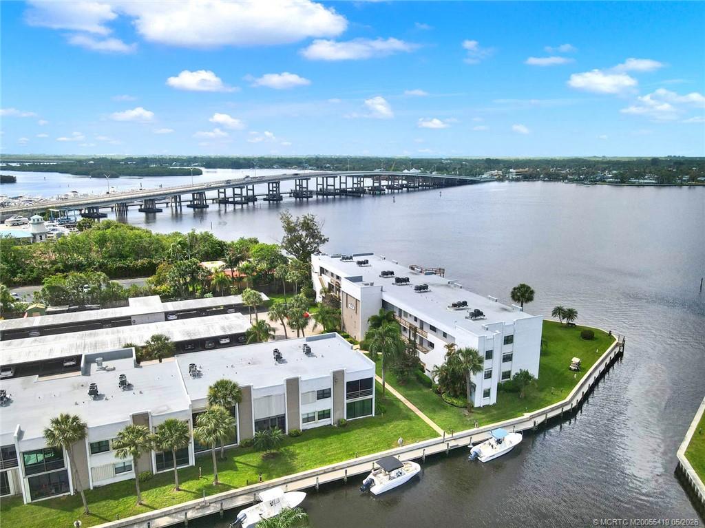 1950 Southwest Palm City Road, Unit 14305 Stuart, FL 34994 - Photo 50 of 70 a view of a water with a terrace