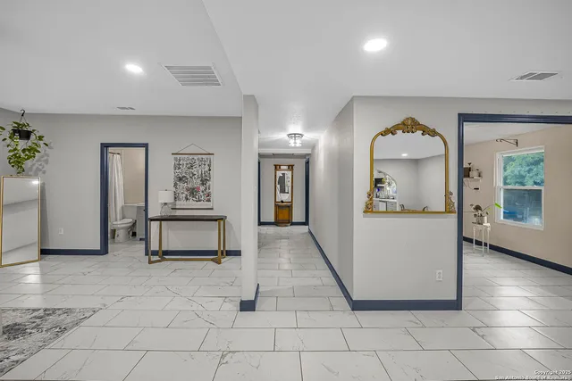 a view of a hallway with dining room