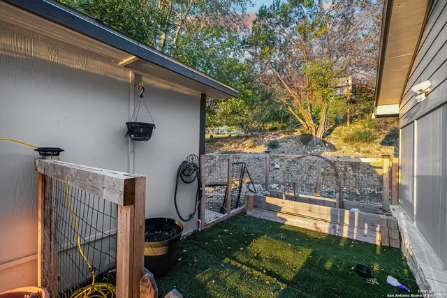 a view of a backyard with sitting area