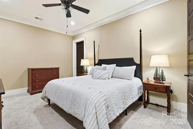 a bedroom with a bed and a lamp