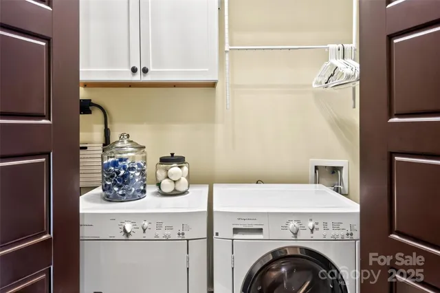 a kitchen with a refrigerator and cabinets