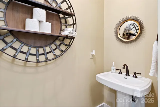 a bathroom with a sink and mirror