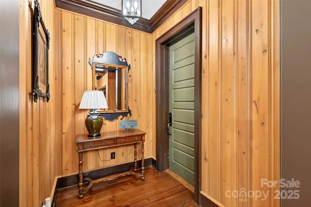 a bedroom with furniture and a chandelier