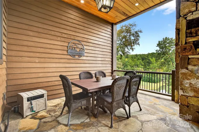 a view of a balcony with furniture