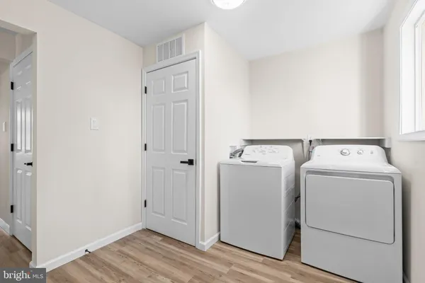 a view of storage and utility room with washer and dryer