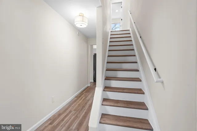 a view of entryway with wooden floor