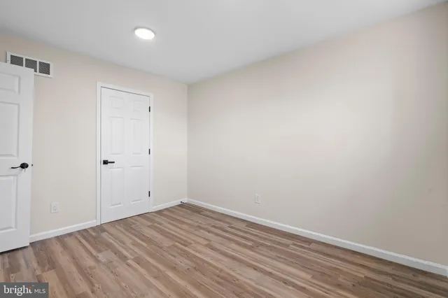 a view of room with wooden floor
