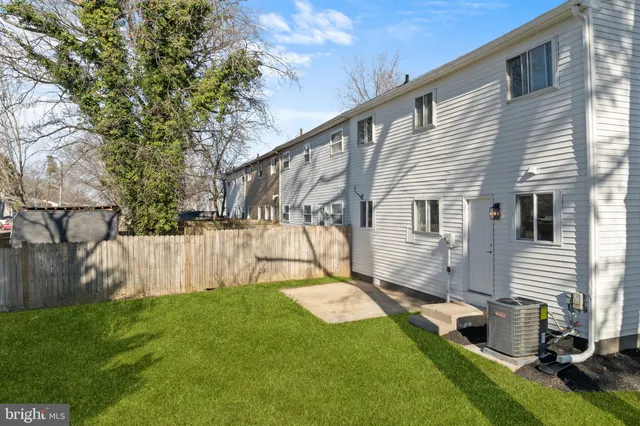 a view of backyard with a garden and a tree
