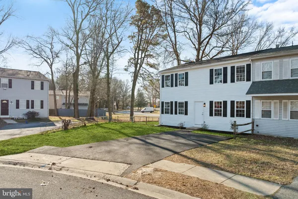 a house that has a tree in front of it