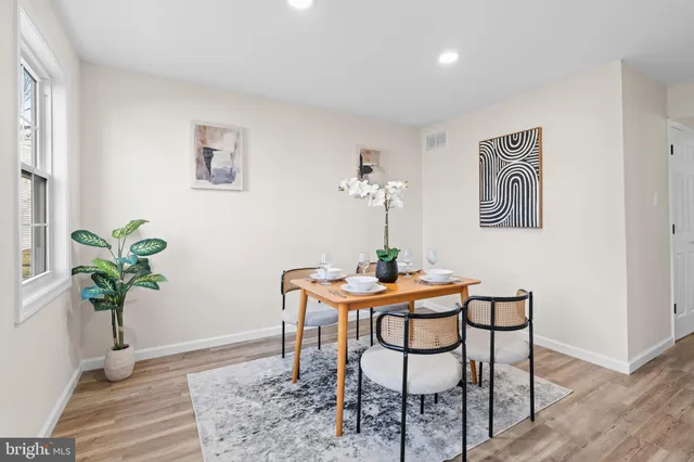 a view of a livingroom with furniture and a table