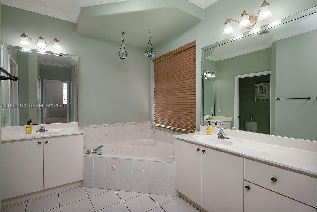 3436 Southwest 152nd Pass Miami, FL 33185 - Photo 16 of 36 a bathroom with a sink vanity tub and shower