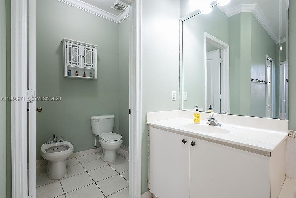 3436 Southwest 152nd Pass Miami, FL 33185 - Photo 17 of 36 a bathroom with a toilet sink and mirror