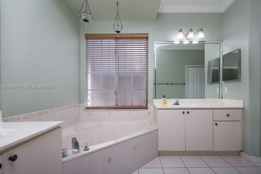3436 Southwest 152nd Pass Miami, FL 33185 - Photo 19 of 36 a bathroom with a tub sink and mirror