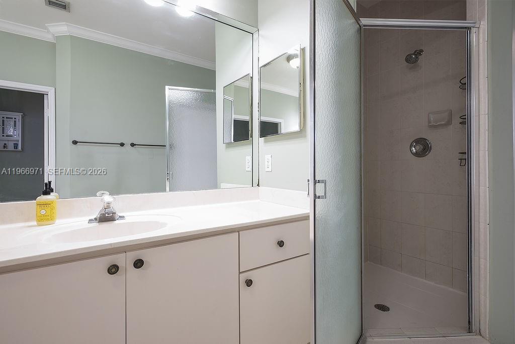 3436 Southwest 152nd Pass Miami, FL 33185 - Photo 20 of 36 a bathroom with a sink and a mirror