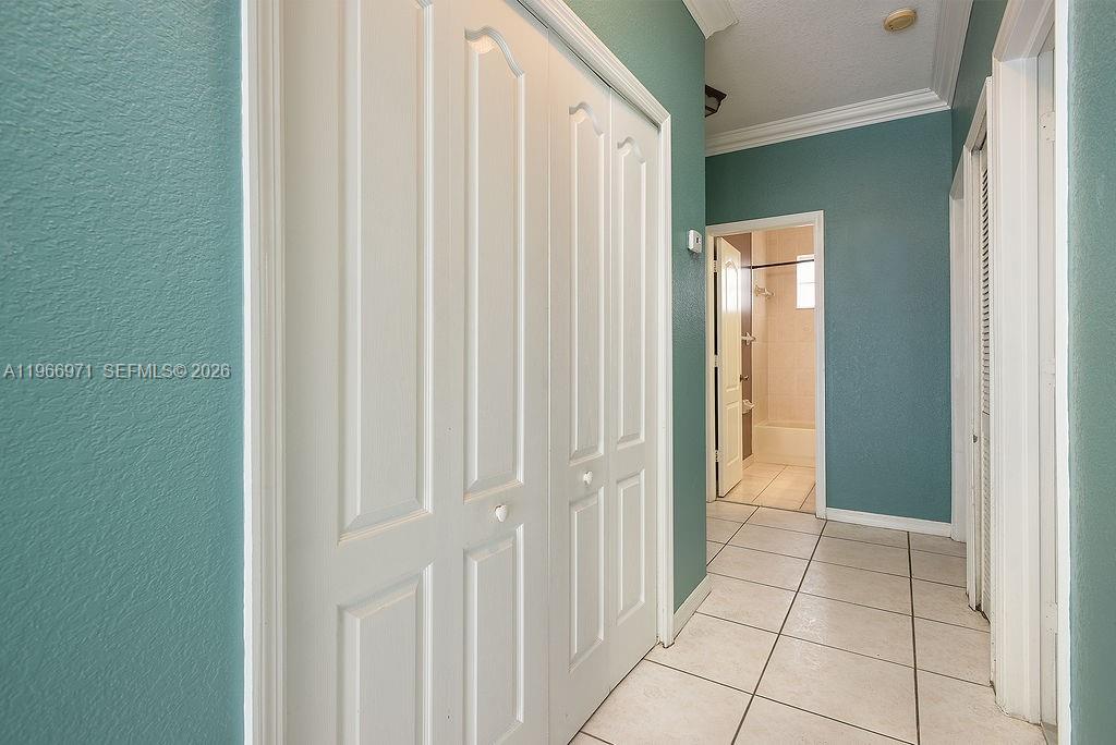 3436 Southwest 152nd Pass Miami, FL 33185 - Photo 21 of 36 a view of a hallway with wooden floor and staircase
