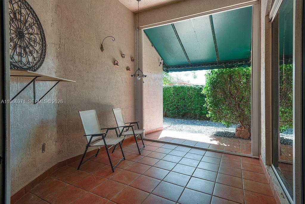 3436 Southwest 152nd Pass Miami, FL 33185 - Photo 27 of 36 a view of a porch with furniture and garden