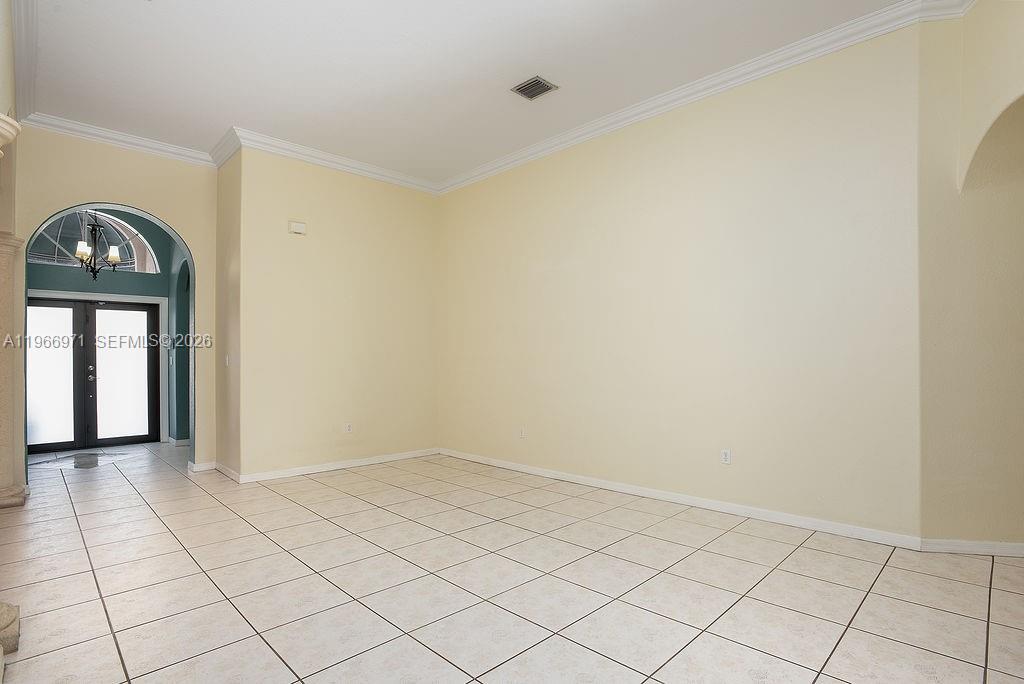 3436 Southwest 152nd Pass Miami, FL 33185 - Photo 3 of 36 a view of an empty room and window