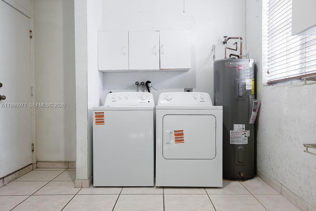 3436 Southwest 152nd Pass Miami, FL 33185 - Photo 32 of 36 a utility room with dryer and washer