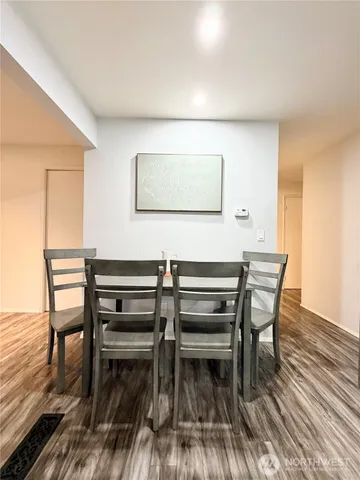 a view of dining room and wooden floor