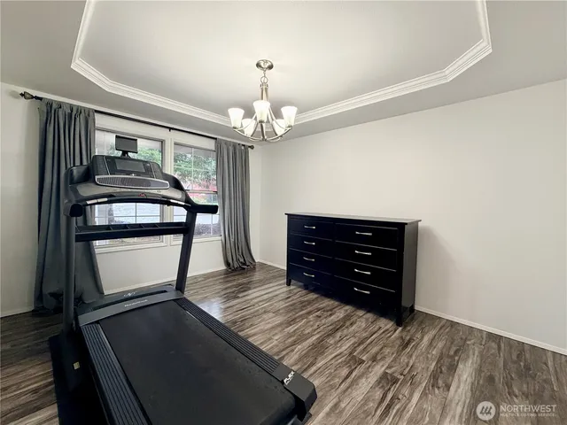 a room with furniture and a dresser