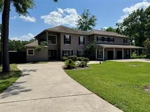 a front view of a house with a garden and porch