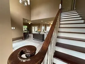 a kitchen with refrigerator and cabinets