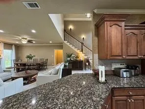 a dining room with furniture and window