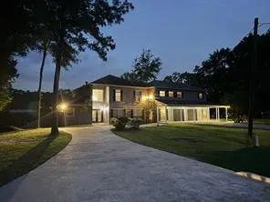 a front view of a house with a yard table and chairs
