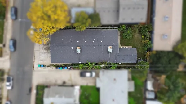 an aerial view of multiple houses with outdoor space