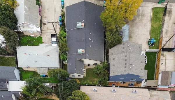 an aerial view of residential houses with outdoor space