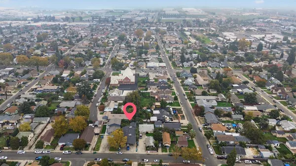 an aerial view of residential houses with outdoor space