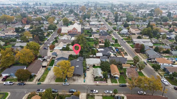 an aerial view of a house with a yard and a garden