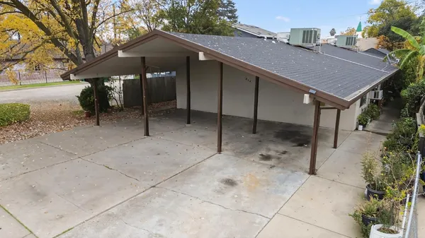 a view of a house with backyard and patio