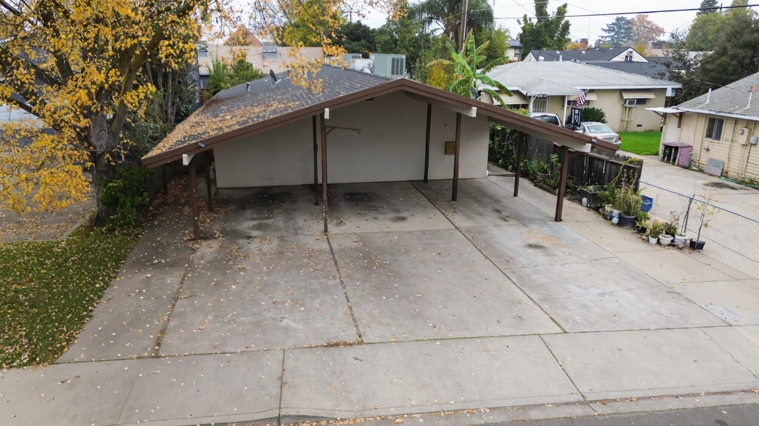 834 South Washington Street Lodi, CA 95240 - Photo 39 of 42 a small barn with a table and chairs under an umbrella