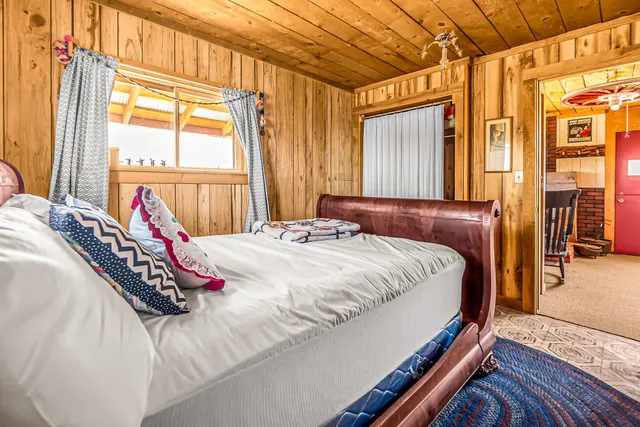 a view of a balcony with wooden floor